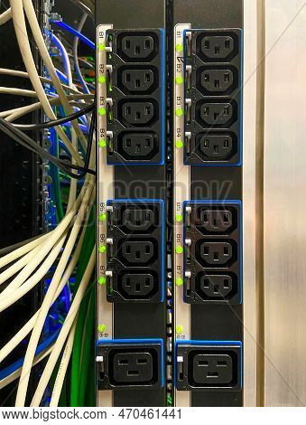 Power Sockets On Power Bar Mounted On Side Of Data Equipment Rack