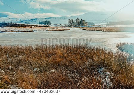 The Frozen Lake At Mynydd Illtud Common In Winter.
