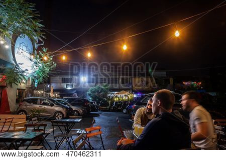 Belgrade, Serbia - June 25, 2022: Selective Blur On Blurry Young Serbian Men Sitting At The Terrace 