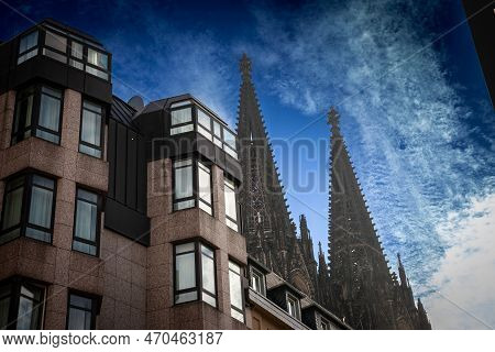 Cologne Cathedral With A Residential Apartment Building In Front With Blue Sky. Cologne Cathedral, O