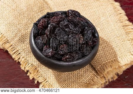 Healthy Food - Nuts Dehydrated Grapes; Photo On Wooden Background
