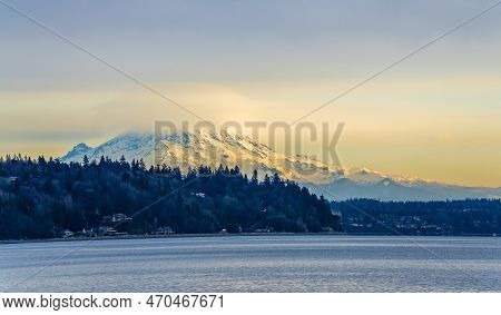 Clouds Cover Mount Rainier Across The Puget Soud In Washington State.