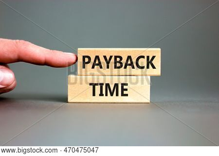 Payback Time Symbol. Concept Words Payback Time On Wooden Blocks. Beautiful Grey Table Grey Backgrou