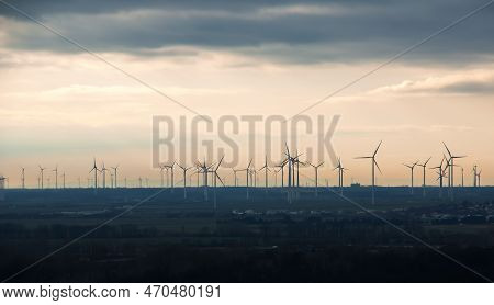 Wind Farm Or Wind Farm At Sunset In Cloudy Weather In Austria In Europe, Allows You To Get Clean Ene