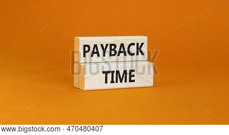 Payback Time Symbol. Concept Words Payback Time On Wooden Blocks. Beautiful Orange Table Orange Back