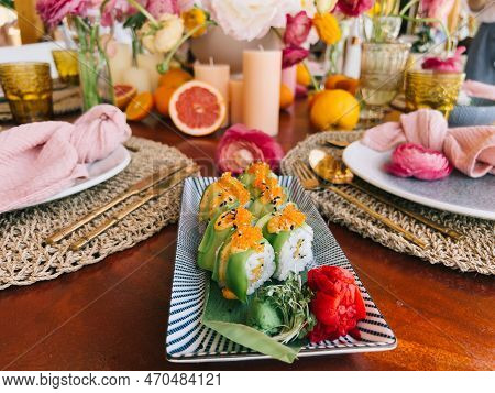 Green Dragon Rolls Lie On A Bamboo Leaf On A Rectangular Dish On The Table