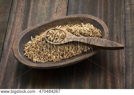 Fennel Seeds In A Small Wooden Bowl - Foeniculum Vulgare