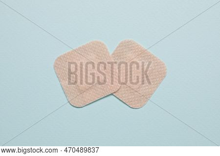 Contraceptive Patches On Light Blue Background, Flat Lay