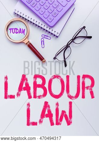 Hand Writing Sign Labour Law. Business Overview Rules Implemented By The State Between Employers And