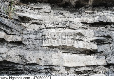 Cliffs In East Cliff Beach In Lyme Regis, Dorset, South West England. Close Up Of Stacked Under Time