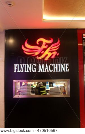 Flying Machine Company Neon Board Outside A Store In A Mall. Red Colored Brand Logo Outside A Mall. 