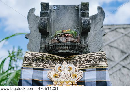 Traditional Balinese House Of Spirits Made Of Stone Contains Canang Sari