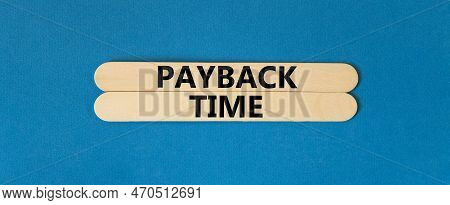 Payback Time Symbol. Concept Words Payback Time On Wooden Stick. Beautiful Blue Table Blue Backgroun