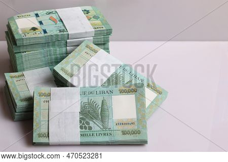 Stacks Of Lebanese Pounds, 100,000 Denomination, Symbolizing The Downfall Of The Lebanese Currency.