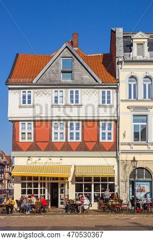 Wolfenbuttel, Germany - March 23, 2022: 
People At A Cafe On The Central Market Square In Wolfenbutt
