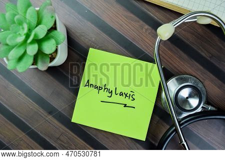 Concept Of Anaphylaxis Write On Sticky Notes Isolated On Wooden Table.