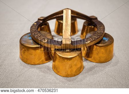 Church Hand Bell For Ringing At Mass And Other Celebrations With A Sign Sanctus. English Translation