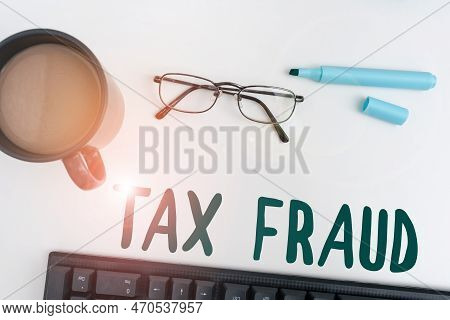 Text Sign Showing Tax Fraud. Business Concept Entails Cheating On A Tax Return In An Attempt To Avoi