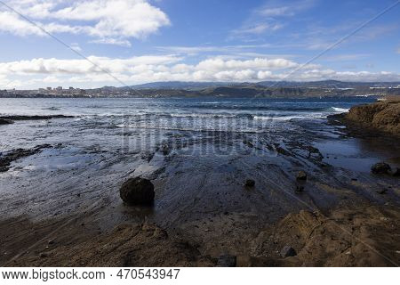 Las Palomas Panorama: A Rocky Beach View With Hilld On Thr Right