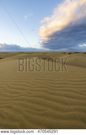 Maspalomas Dunes Before The Sunset. Landscape Photo Of Beautiful Desert And Ocean.