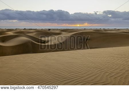 Maspalomas Dunes Before The Sunset. Landscape Photo Of Beautiful Desert And Ocean.