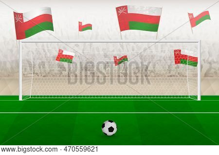 Oman Football Team Fans With Flags Of Oman Cheering On Stadium, Penalty Kick Concept In A Soccer Mat