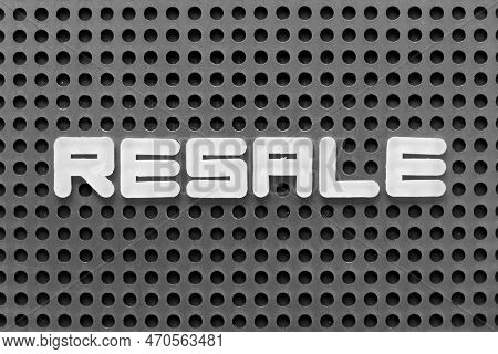 White Alphabet Letter In Word Resale On Black Pegboard Background