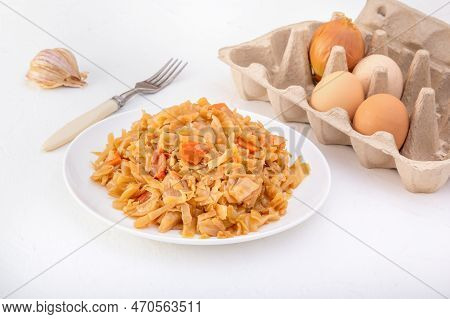 Stewed Cabbage - Bigos In A White Plate On A Light Background. Close-up