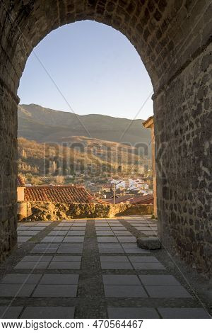 Stone Arch Church Of Santa Maria In Portrait With Landscape In The Background Of The Mountain Of Her