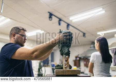Man Sculptor Creates Sculpt Bust Clay Human Woman Model Sculpture. Statue Craft Creation Workshop St