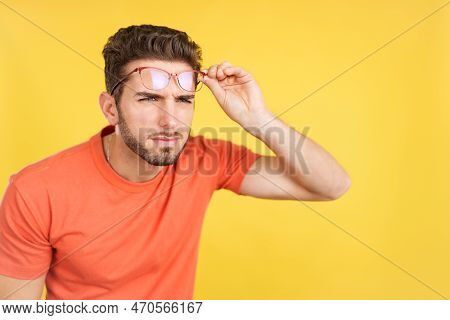 Caucasian Man Taking Off Her Glasses To See Far Away