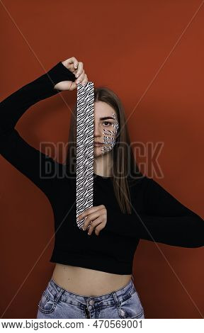 Portrait Of A Beautiful Young Woman With A Pasted Konesiotape For Rejuvenation And Facelift Without 