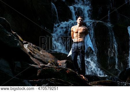 Muscular Man Going To Swim In Waterfall Water. Flow Of Dollars. Profit Business Concept. Businessman