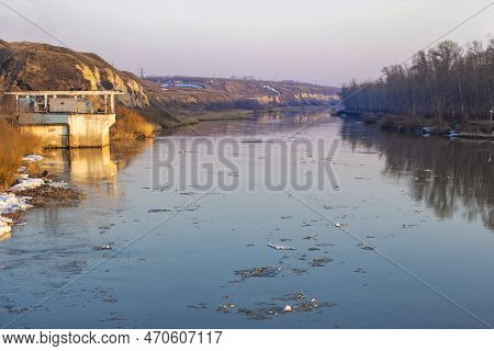 Spring Ice Drift On The River In Muddy Water Before High Water And Flood, Front And Background Blurr