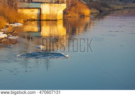 Spring Ice Drift On The River In Muddy Water Before High Water And Flood, Front And Background Blurr