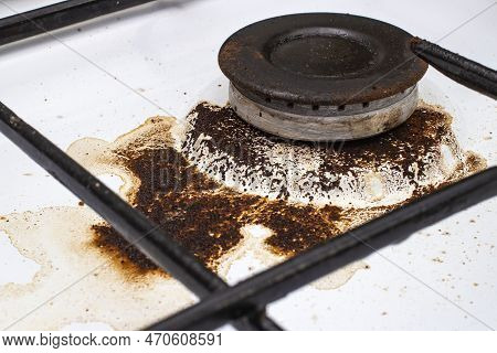 Dirty Gas Stove With Spilled Coffee From Cezve, Front And Background Blurred With Bokeh Effect