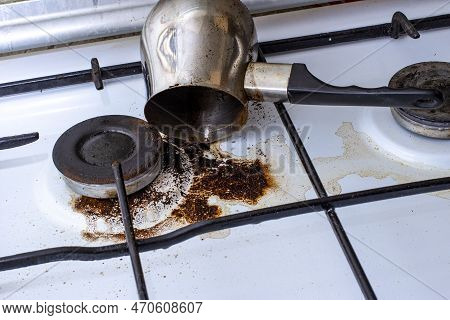 Dirty Gas Stove With Spilled Coffee From Cezve, Front And Background Blurred With Bokeh Effect