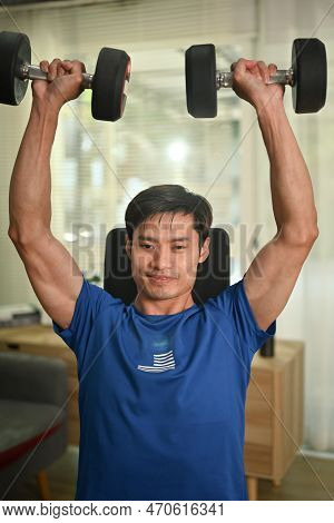 Strong Young Asian Man Lifting Dumbbells During Morning Workout At Home. Healthy Lifestyle And Fitne
