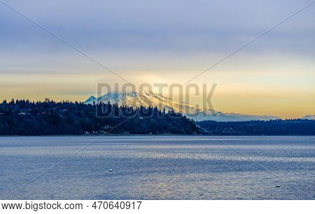 Clouds Cover Mount Rainier Across The Puget Soud In Washington State.