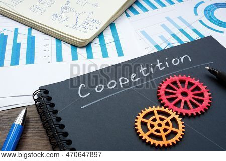 Notebook With Inscription Coopetition And Cog Wheels.