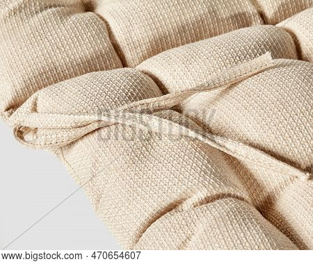 Closeup Of Natural Beige Fabric Covering Of Chair Cushion