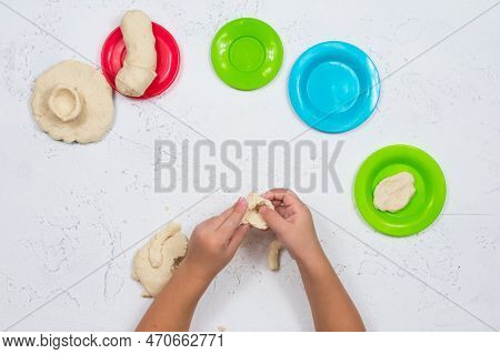 Childrens Hands Are Sculpted From Salt Dough. Development Of Fine Motor Skills Of The Hands. Develop