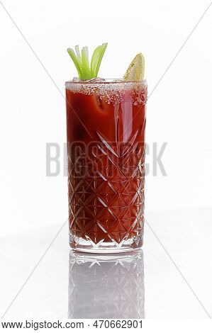 Bloody Mary Cocktail With A Slice Of Lemon And Frappe, On A White Background