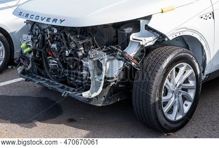 Monroeville, Pennsylvania, Usa February 12, 2023 A White Land Rover Discovery Suv At A Dealership Wi