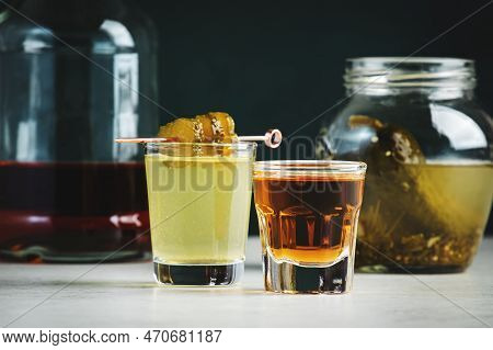 Pickleback, Alcoholic Cocktail Made From Cucumber Pickle And Whiskey In Small Shot Glasses