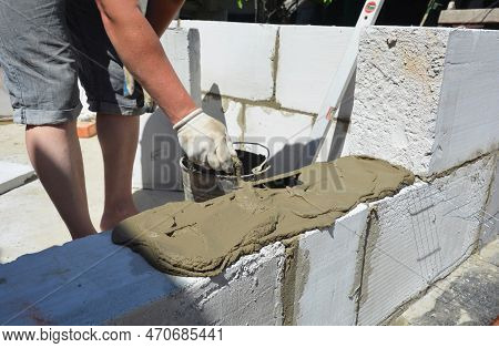 Builder Contractor Laying White Autoclaved Aerated Concrete Aac Blocks With Concrete During House Bl