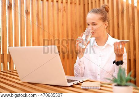 Portrait Of Attractive Delighted Charming Smiling Woman Freelancer Or Student Wearing White Shirt, W