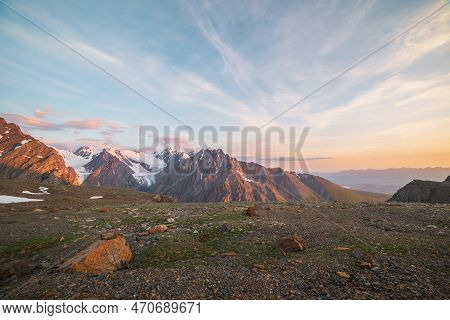 Vivid Alpine Landscape With High Snow Mountains And Large Glacier In Sunrise Colors. Colorful Scener