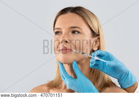 Middle Aged Woman Gets Cosmetic Injection In Her Lips, Clpseup
