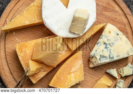 Parmesan. Different Types Of Cheese With Knife On A Dark Background. Cheeses Set Dor Blu Chedar Cama